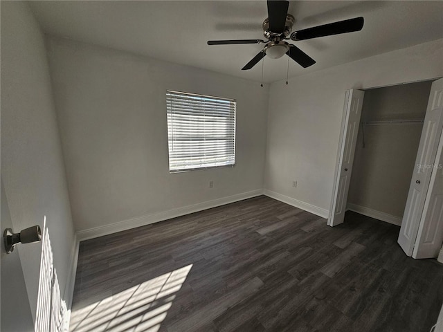 unfurnished bedroom featuring a closet, ceiling fan, and dark wood-type flooring