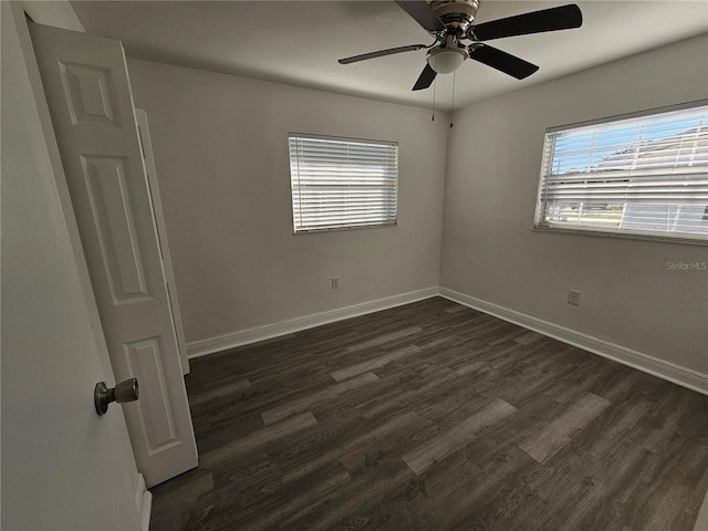 unfurnished room featuring ceiling fan and dark hardwood / wood-style floors