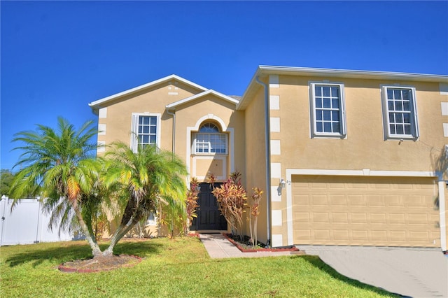 view of front of property with a garage and a front lawn