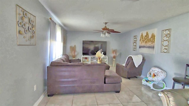 living room with light tile patterned floors and ceiling fan