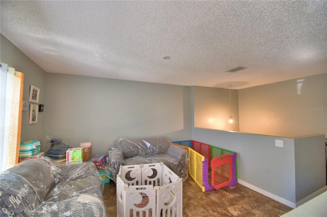 living room featuring a textured ceiling