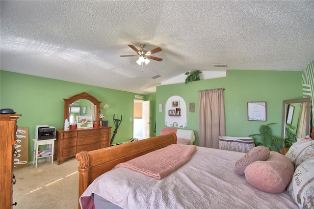 bedroom with a textured ceiling, ceiling fan, light colored carpet, and lofted ceiling