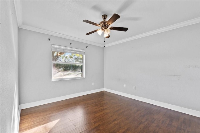 empty room with ceiling fan, crown molding, and dark wood-type flooring