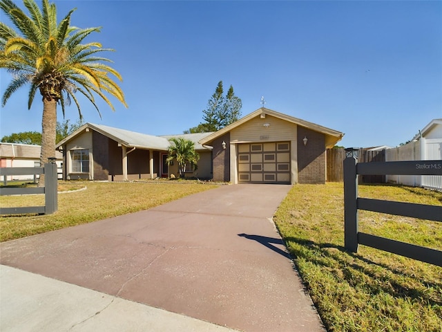 single story home with a garage and a front yard