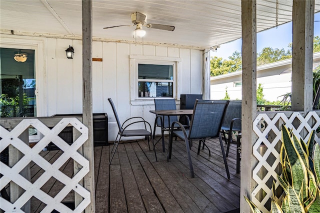 wooden deck featuring ceiling fan