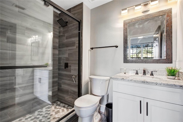 1591 Forest Hills Ln, Haines City, FL 33844 - bathroom with vanity, toilet, and a shower stall