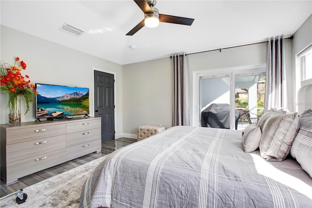 bedroom featuring ceiling fan, dark hardwood / wood-style flooring, and access to exterior