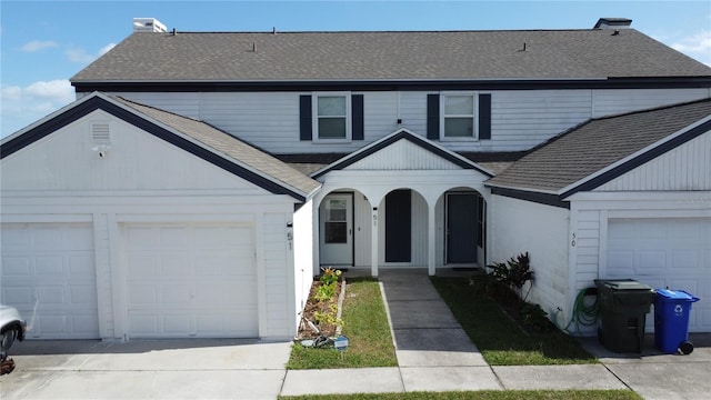 front of property with a garage