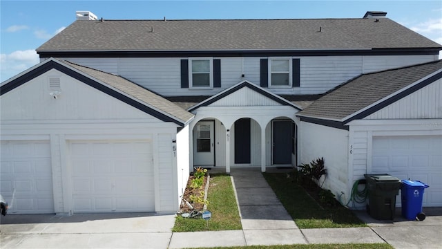 front of property with a garage