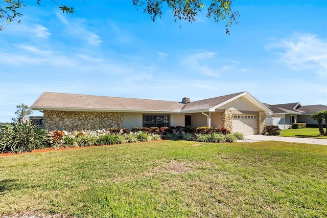 ranch-style home with a garage, stone siding, a front yard, and driveway