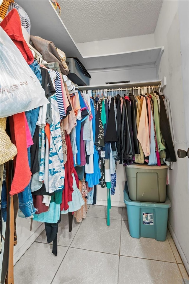 spacious closet featuring tile patterned floors