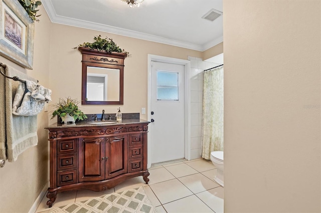 bathroom with visible vents, toilet, tile patterned floors, crown molding, and vanity