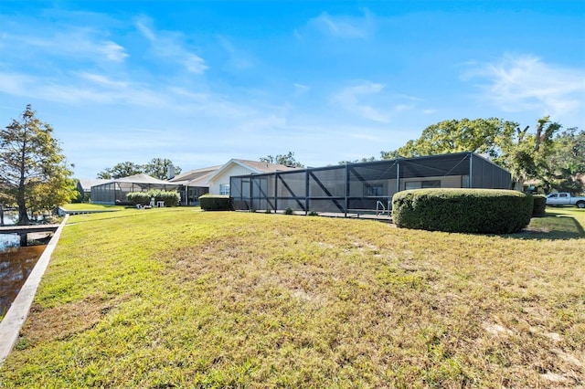 view of yard featuring glass enclosure