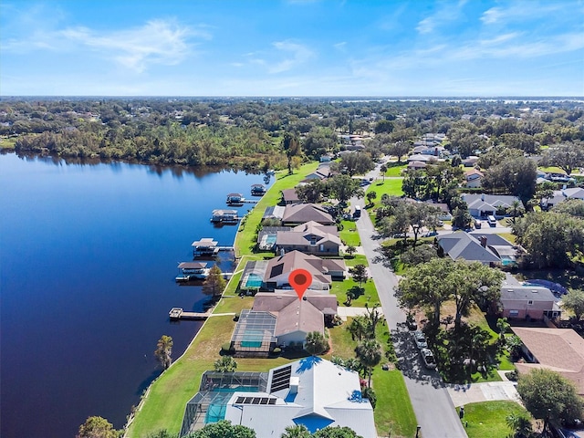 drone / aerial view featuring a water view and a residential view