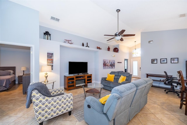 tiled living room with high vaulted ceiling and ceiling fan