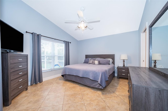 bedroom with ceiling fan, lofted ceiling, and light tile patterned floors