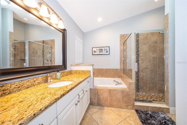 bathroom featuring tile patterned flooring, vanity, plus walk in shower, and lofted ceiling