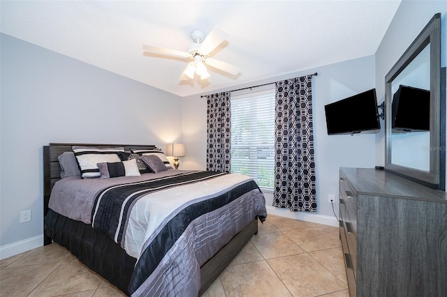 tiled bedroom with ceiling fan