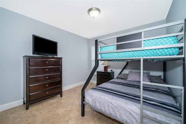 bedroom with light tile patterned floors