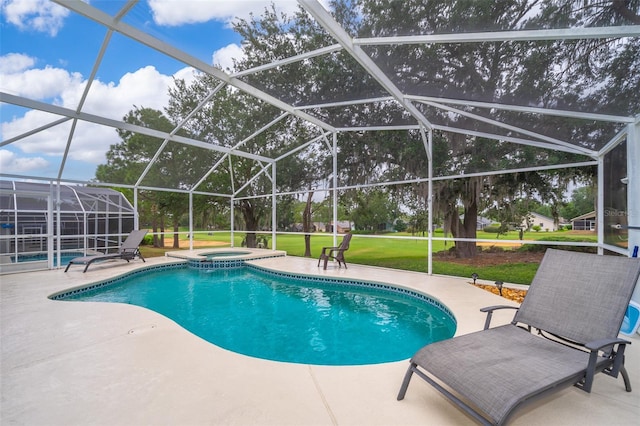 view of swimming pool with an in ground hot tub, a patio, and a lanai