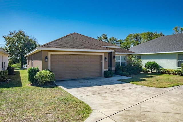 ranch-style house featuring a garage and a front yard