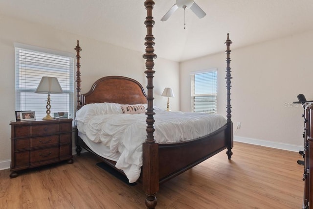 bedroom with ceiling fan and light hardwood / wood-style flooring