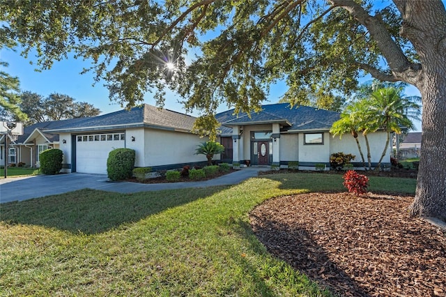 ranch-style house with a front yard and a garage