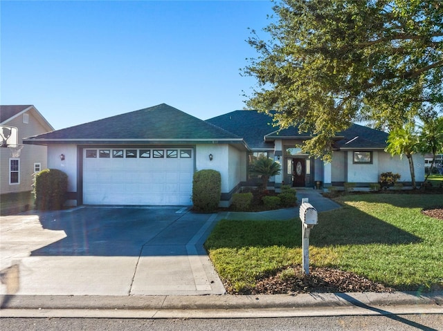 single story home featuring a front yard and a garage