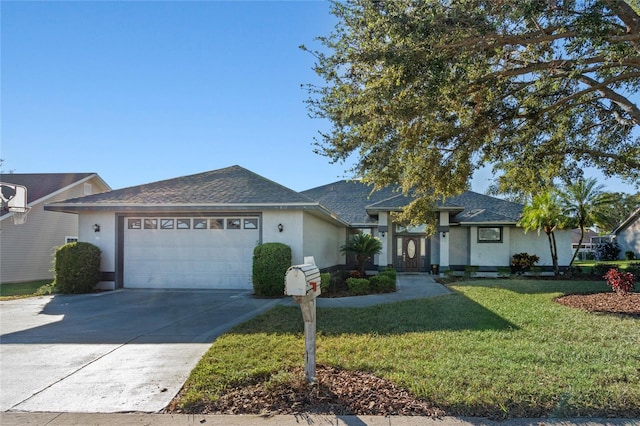 ranch-style home featuring a front lawn and a garage