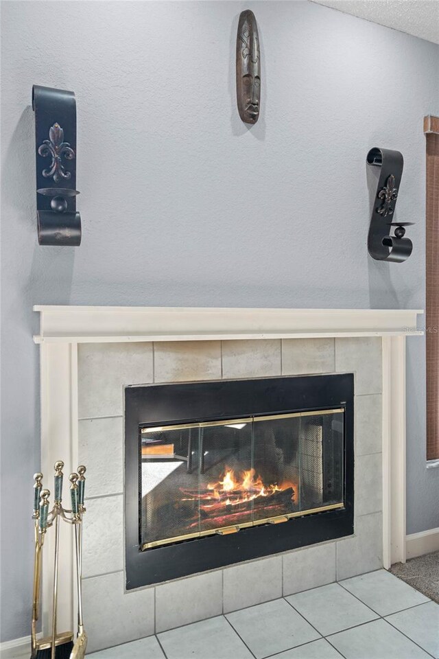 details featuring a tile fireplace