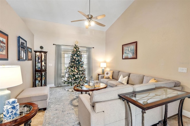 living room with high vaulted ceiling and ceiling fan