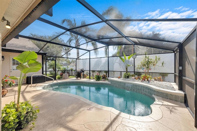 view of pool with a lanai and a patio