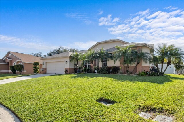 ranch-style house with a garage and a front yard