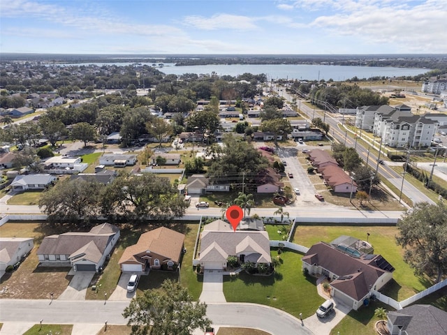 birds eye view of property with a water view