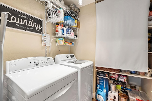 laundry room featuring washing machine and clothes dryer