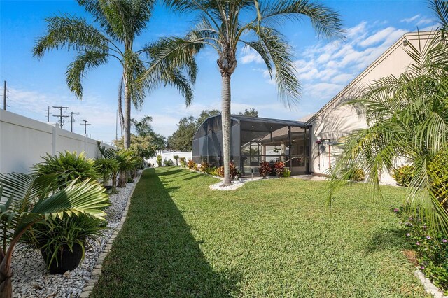 view of yard featuring a lanai