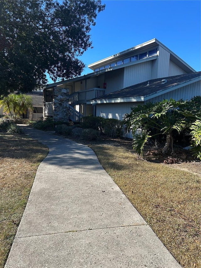 view of property exterior featuring a lawn