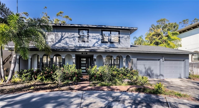 view of front of property with a garage