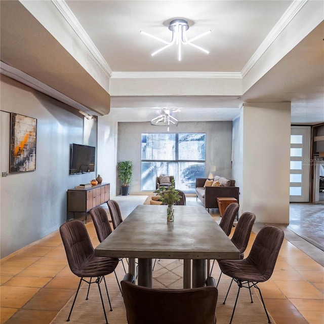 dining space with crown molding and an inviting chandelier