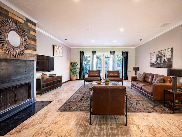 living room featuring a large fireplace, ornamental molding, and light hardwood / wood-style flooring