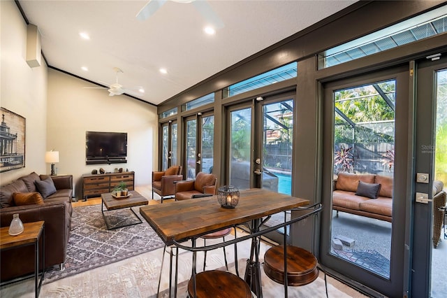 interior space with ceiling fan, french doors, and lofted ceiling