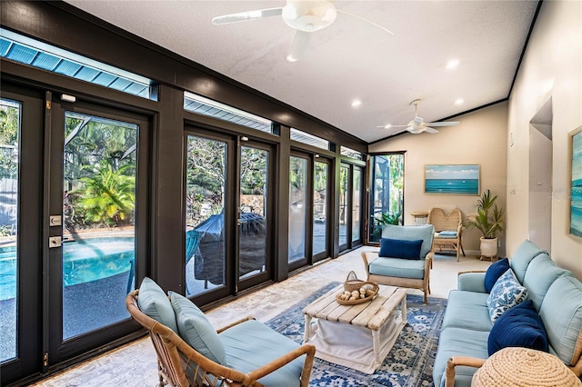 interior space with ceiling fan and lofted ceiling