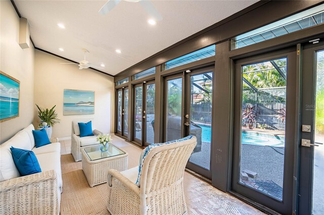 sunroom with french doors, ceiling fan, and lofted ceiling