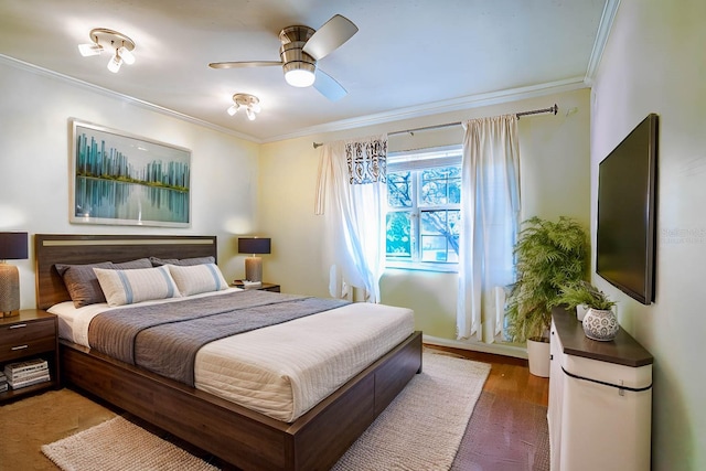 bedroom featuring ceiling fan, wood-type flooring, and ornamental molding