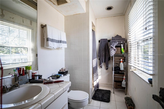 full bathroom with shower / bath combo, tile patterned floors, vanity, tile walls, and toilet