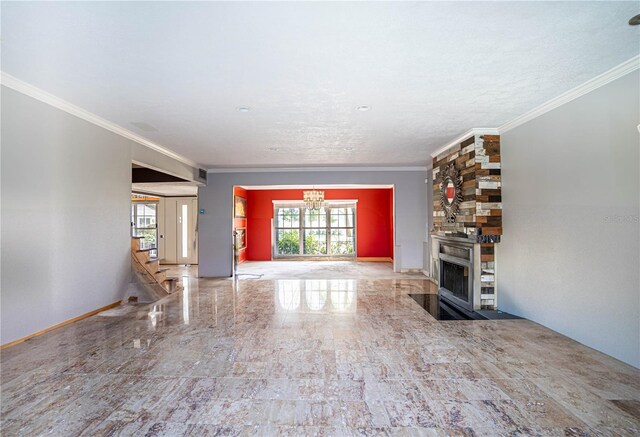 unfurnished living room featuring crown molding and a large fireplace