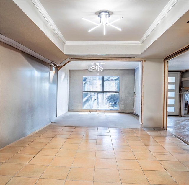 interior space with light tile patterned flooring and ornamental molding