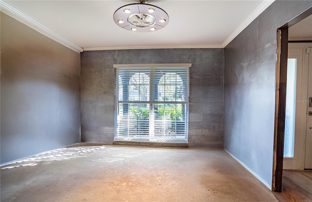 unfurnished room featuring crown molding and concrete floors