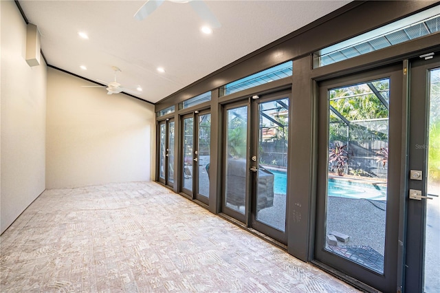 interior space with ceiling fan and french doors