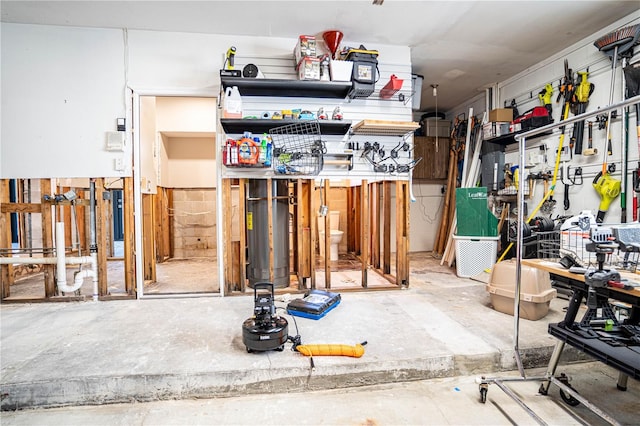 misc room with a workshop area and concrete floors